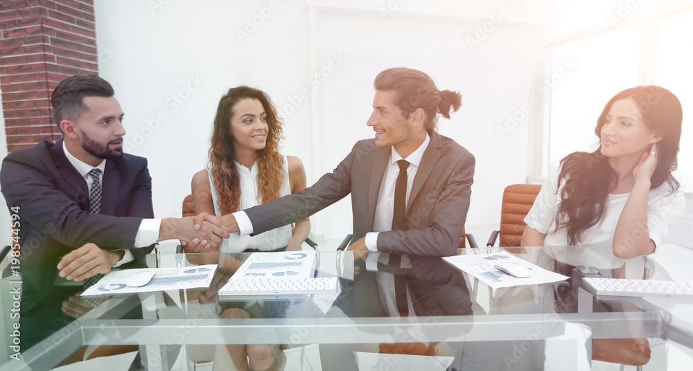 Business people shaking hands, starting a meeting Business people shaking hands, starting a meeting