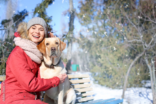 Woman with cute dog in park...