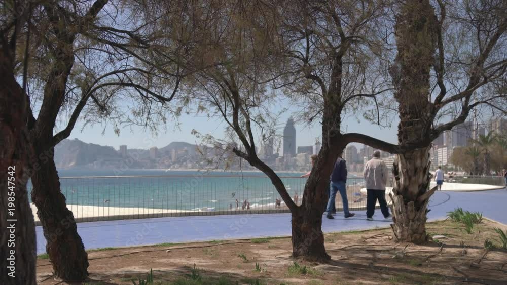 Walking at Benidorm west beach promenade Walking at Benidorm west beach promenade