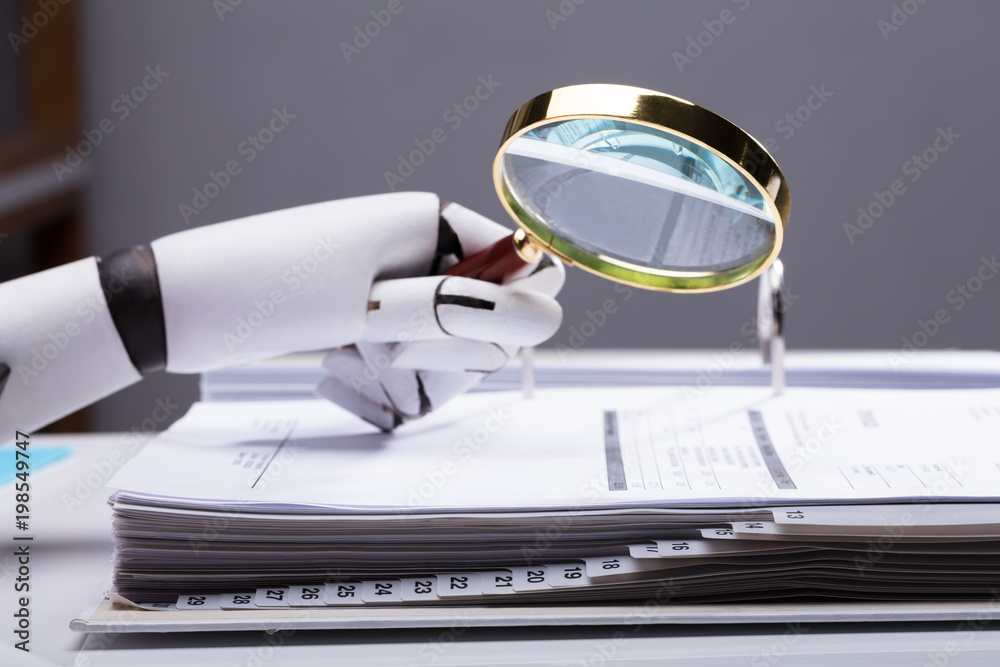 Robot Holding Magnifying Glass Over Invoice Robot Holding Magnifying Glass Over Invoice