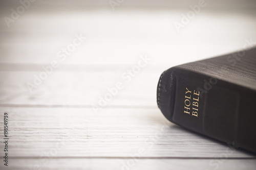 Closed Bible on a Wooden Table