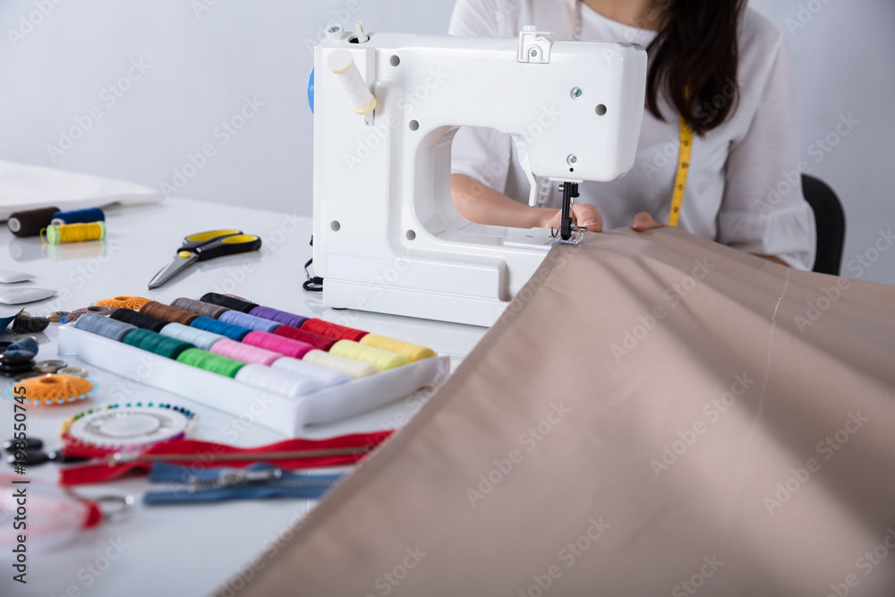 Fashion Designer Stitching Cloth On Sewing Machine