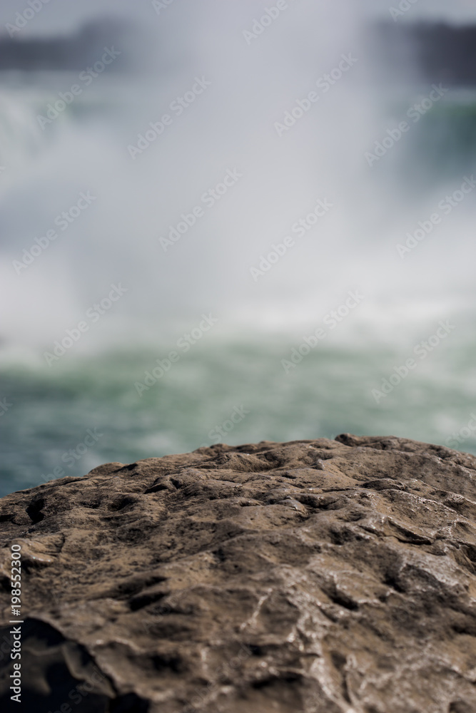 Polished granite with a misty Niagara Falls Polished granite with a misty Niagara Falls
