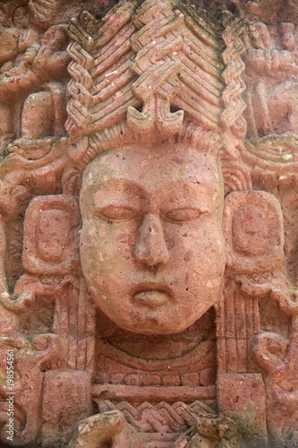 Detail of a face from an antient Mayan stone carving, Roatan, Honduras.