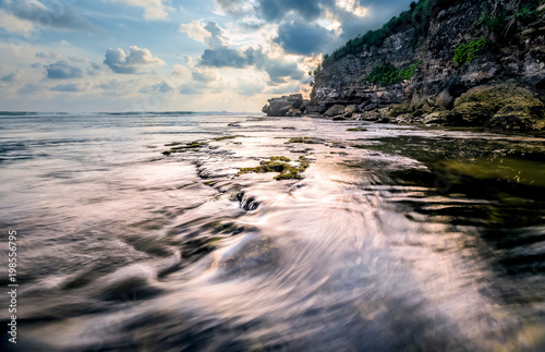 Amazing view of Yogyakarta seascape with natural coastal rock as foreground