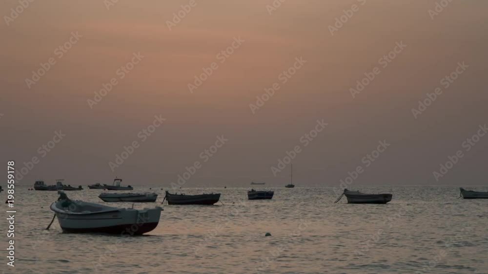Timelapse of anchored boats at sunset Timelapse of anchored boats at sunset