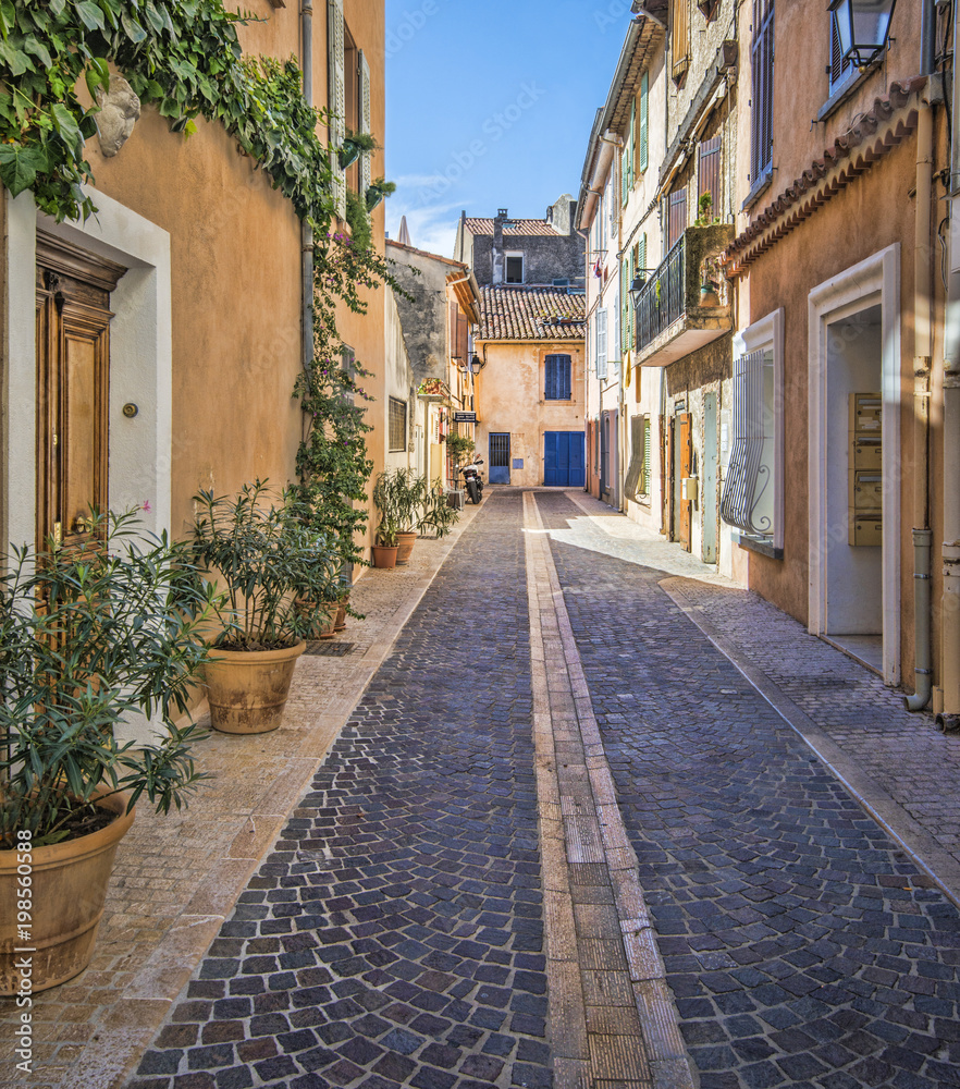 Charming, stone street of colorful, old homes in Southern France