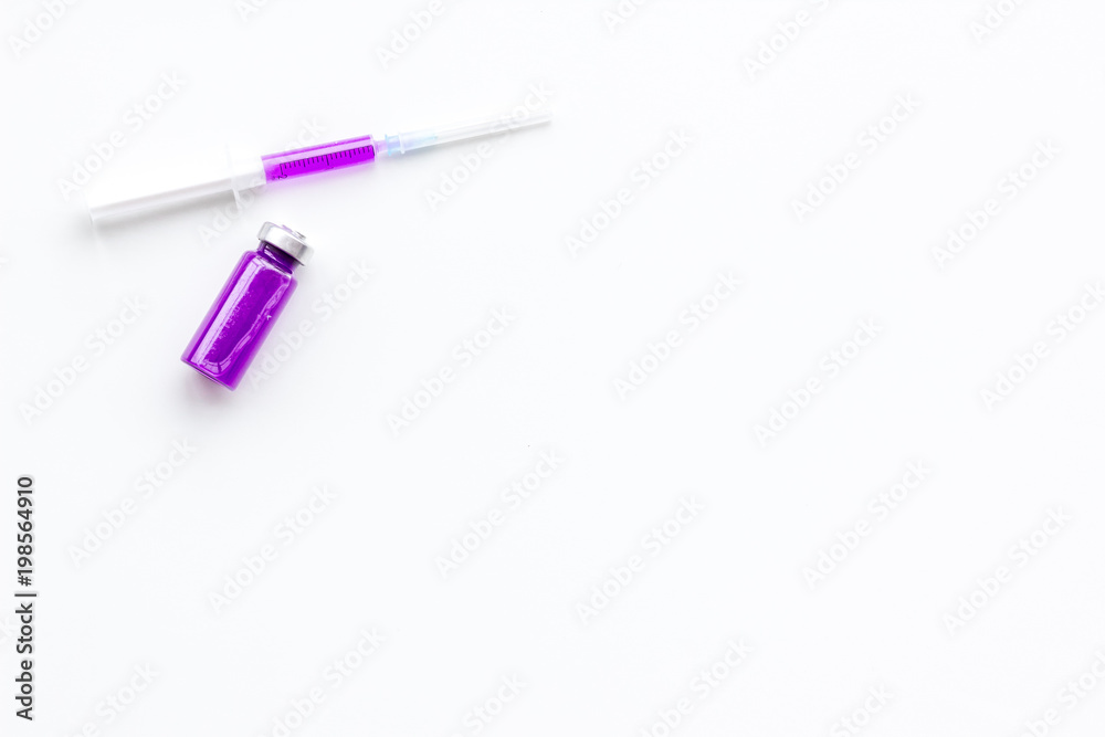 Syringe with medicine. Injection concept on white baclground top view copy space