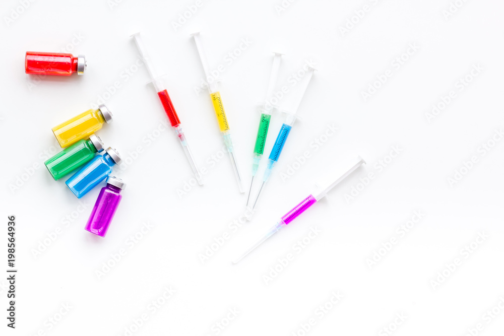 Syringe with medicine. Injection concept on white baclground top view copy space Syringe with medicine. Injection concept on white baclground top view copy space