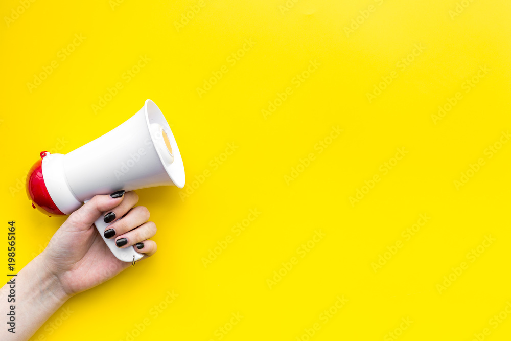Megaphone make an announcement on yellow background top view copy space - obrazy, fototapety, plakaty 