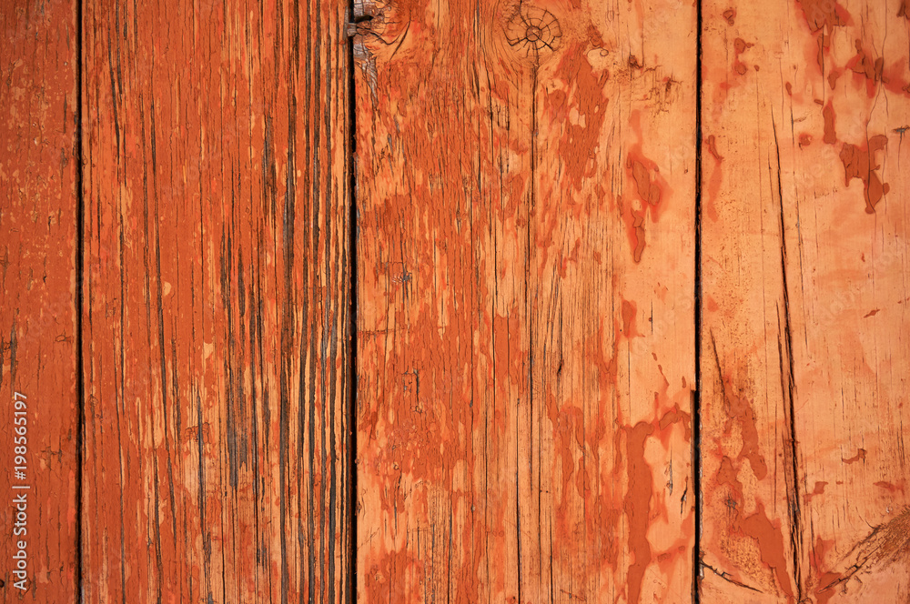 Old wooden background painted in red with cracks. Old wooden background painted in red with cracks.
