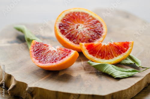 Sliced oranges on the wooden table. Citrus sinensis orange,
