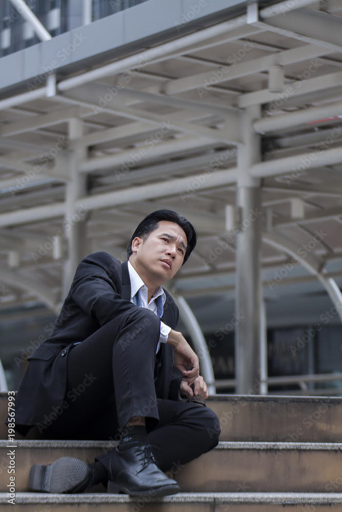 Businessman seated stress after encountering problems, economy and administration errors. Businessman seated stress after encountering problems, economy and administration errors.