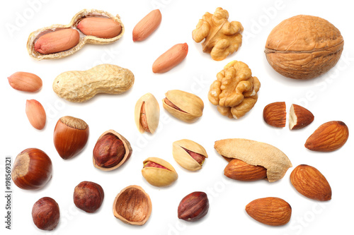 mix almonds, cashew nuts, hazelnut, peanuts, walnuts, pistachio isolated on white background. Top view