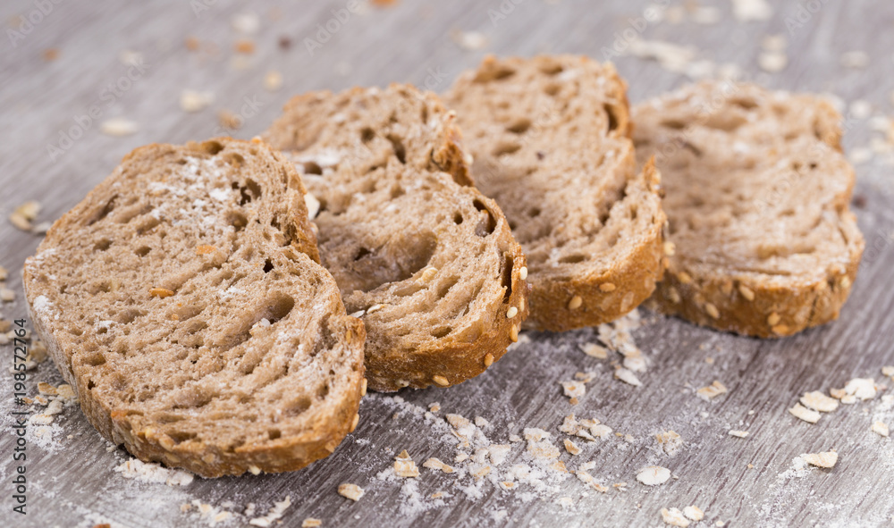 fresh slices of rye bread on wooden surface fresh slices of rye bread on wooden surface