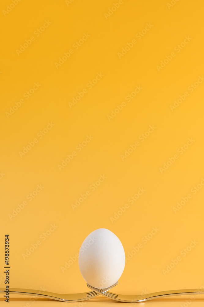 egg white subject with forks on yellow background and text field egg white subject with forks on yellow background and text field