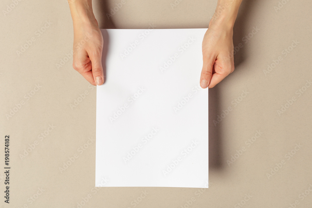 Hand holding papers a4 size Hand holding papers a4 size