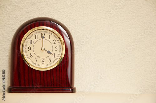 The time for table clock of the room is 4:00  photo