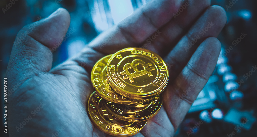 Golden bitcoins with selective focus .New virtual money.