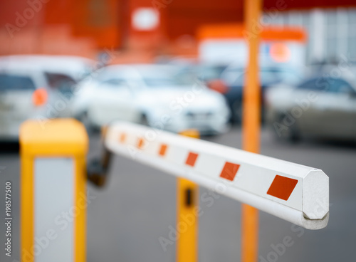 barrier close-up against the background of car parking photo