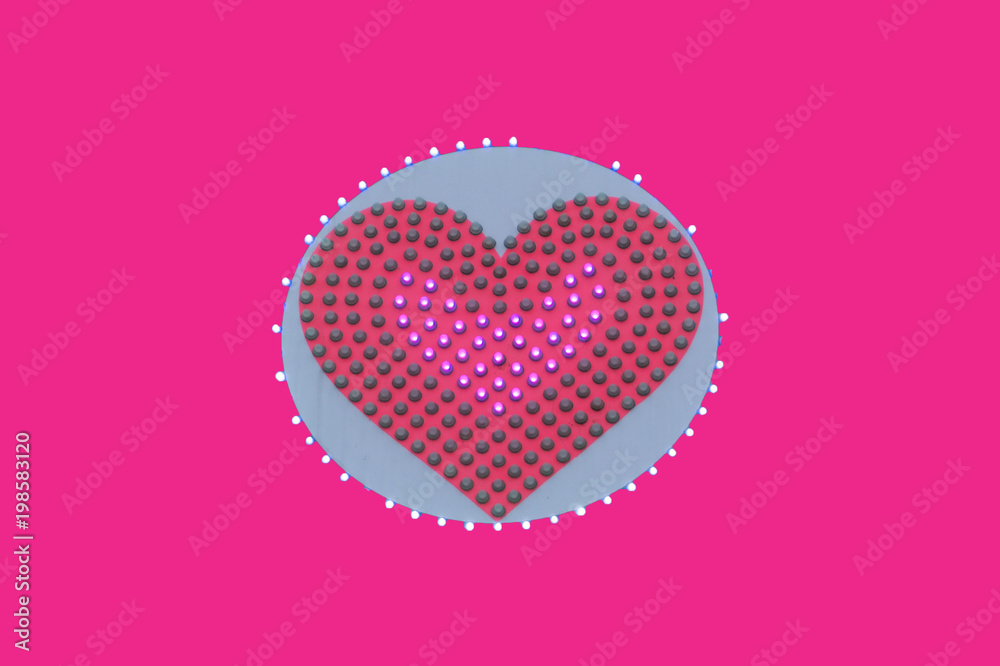 pink heart is painted in pink and white around it .