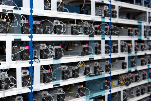 shelves with power supply units for cryptocurrency mining farm