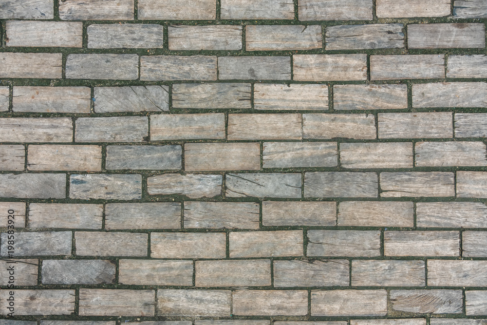 Wooden bricks shaped like concrete material wall, texture with scratches Wooden bricks shaped like concrete material wall, texture with scratches