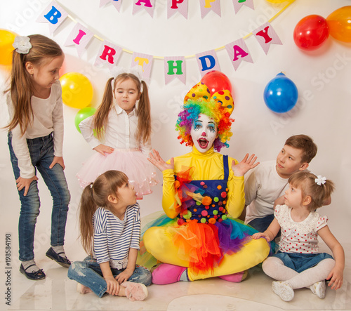 clown girl on the birthday of a child. Party for children. Play and entertain boys and girls