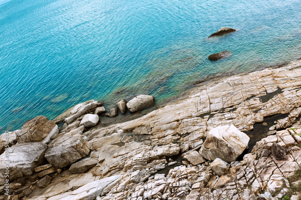 beautiful stones on the sea background beautiful sea view large stones and blue sea beautiful stones on the sea background beautiful sea view large stones and blue sea