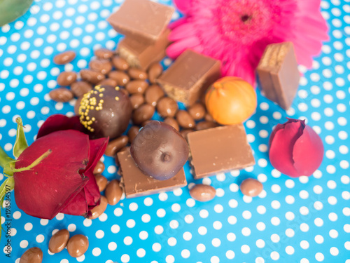 Homemade chocolates on blue background photo