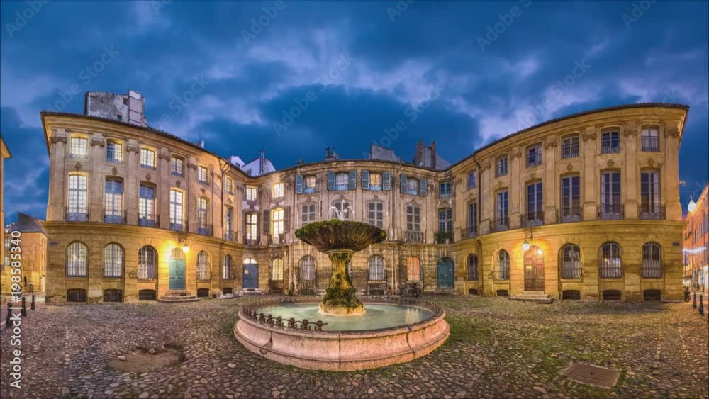 Panorama of Place Albertas square at dusk in Aix-en-Provence, France (static image with animated sky and water)
