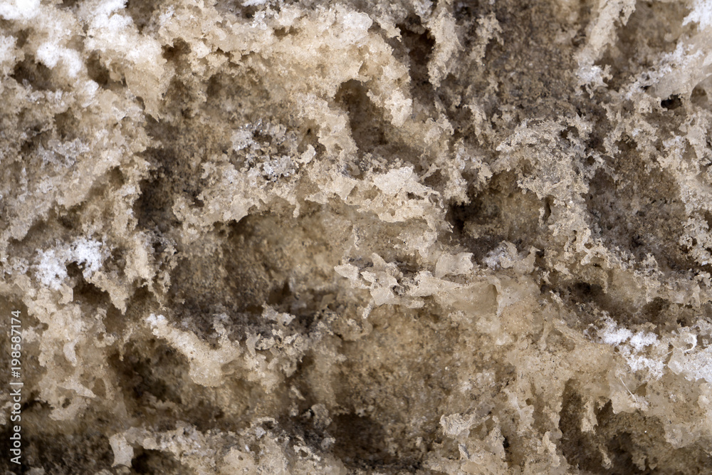Texture of a dirty heavy jagged melting snow turning into ice . Texture of a dirty heavy jagged melting snow turning into ice .