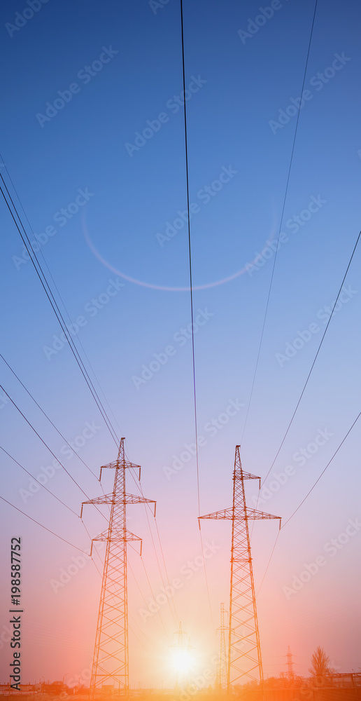 Silhouette High voltage electric tower on sunset time and sky on sunset time background.