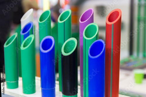 Multicolored plastic water pipes in the store. Industry photo