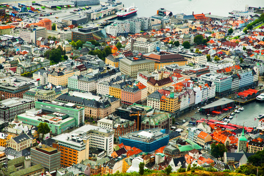 Facades of the colorful wooden houses in Bergen. Famous colored houses and street in Bergen Norway - architecture background Facades of the colorful wooden houses in Bergen. Famous colored houses and street in Bergen Norway - architecture background