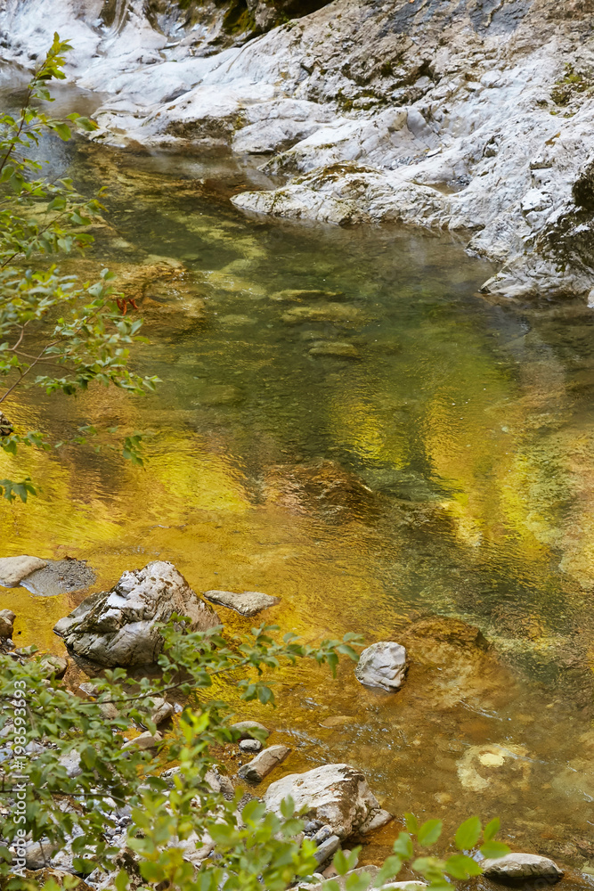 Mountain fast river in the mountains of Italy.