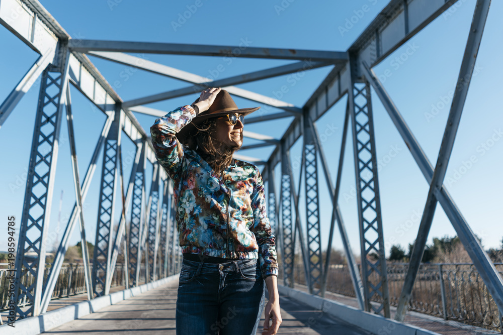 Beautiful girl having fun in the iron bridge Beautiful girl having fun in the iron bridge