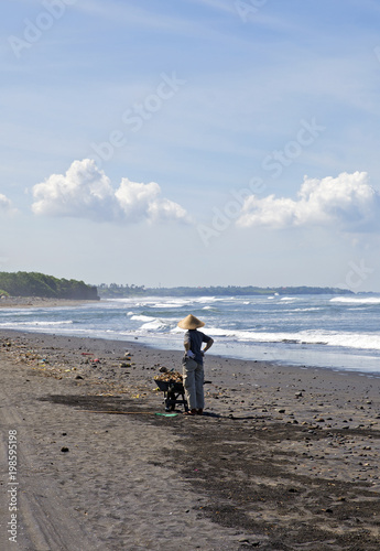 Asian woman working on the beach in bali
