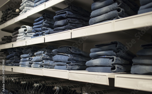 jeans in the store on the shelves photo