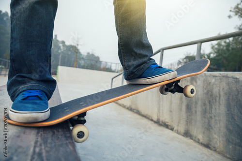 skateboarder legs skateboarding at skate park