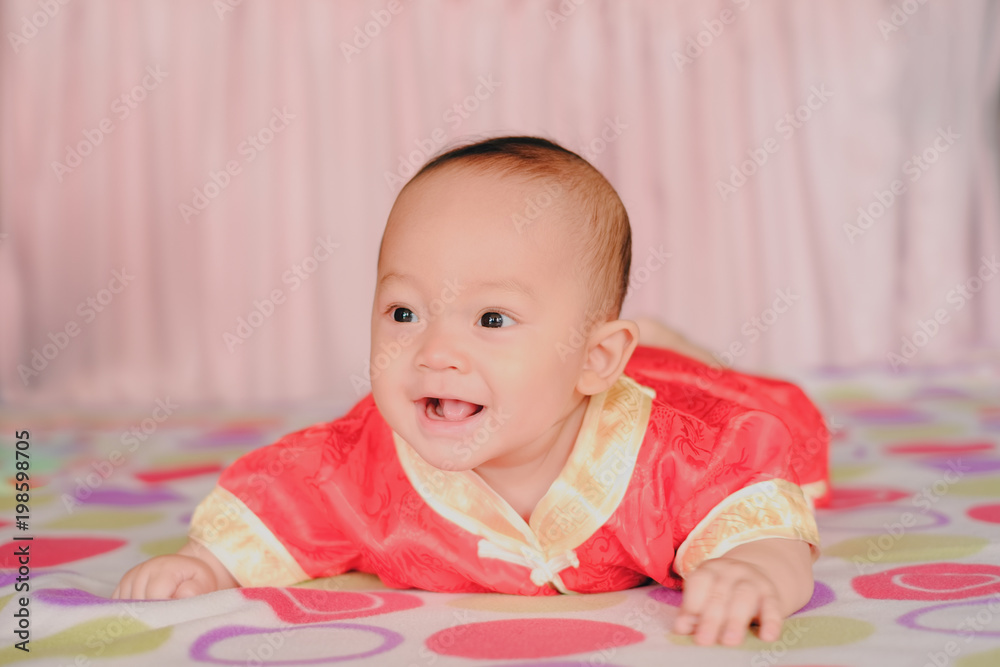 Adorable baby boy in bedroom. Newborn child relaxing in bed. Nursery for young children. Textile and bedding for kids. Family morning at home. New born kid during tummy time. Adorable baby boy in bedroom. Newborn child relaxing in bed. Nursery for young children. Textile and bedding for kids. Family morning at home. New born kid during tummy time.