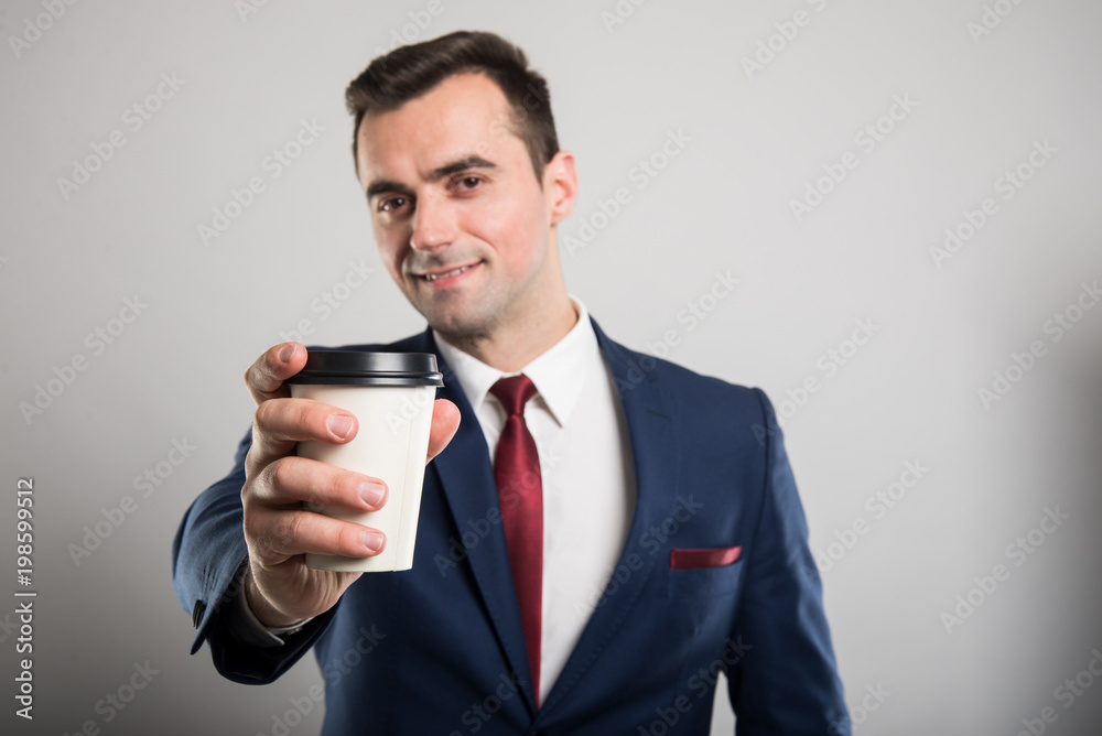Selective focus of business man offering takeaway coffee Selective focus of business man offering takeaway coffee