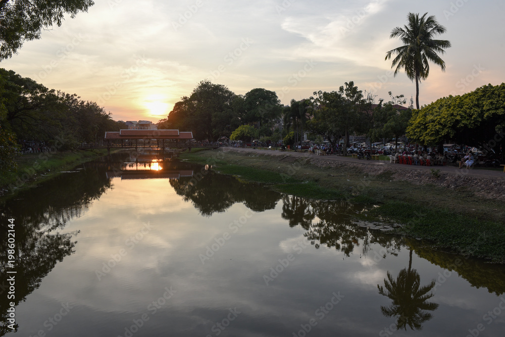 Fototapeta premium River with bridge and night market in Siem Reap, Cambodia