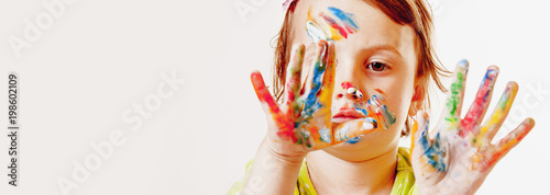 Child girl painting with colorful hands. ( people, childhood, art, holiday, beauty concept)