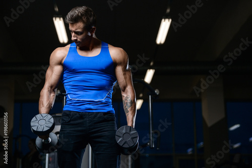 Handsome model young man workout in gym