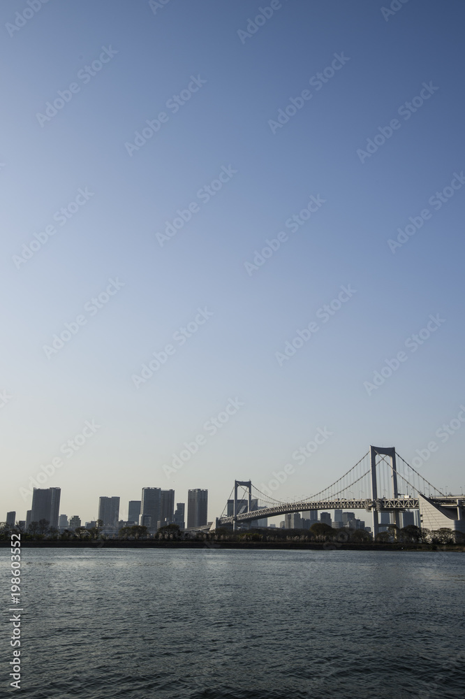 Tokyo Bay with Rainbow Bridge in Background at Dusk
