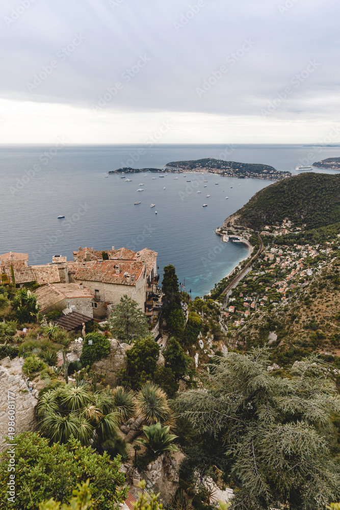 aerial view of european city located on seashore on cloudy day, Eze, France
