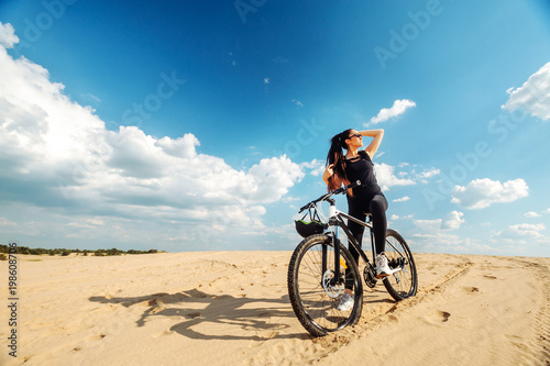 Enjoy moment. Female cyclist cycling on track with road bicycle speed and sprint and sports wellness concept. Sunglasses.