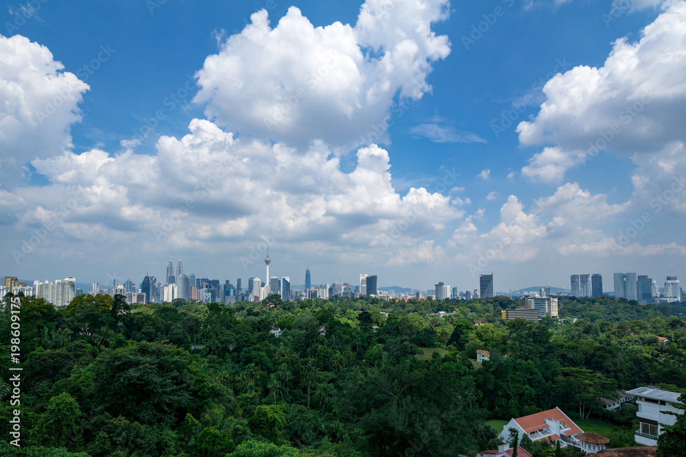 A clear and windy day in Kuala Lumpur, capital of Malaysia. Its modern skyline is dominated by the 451m tall KLCC, a pair of glass and steel clad skyscrapers. A clear and windy day in Kuala Lumpur, capital of Malaysia. Its modern skyline is dominated by the 451m tall KLCC, a pair of glass and steel clad skyscrapers.