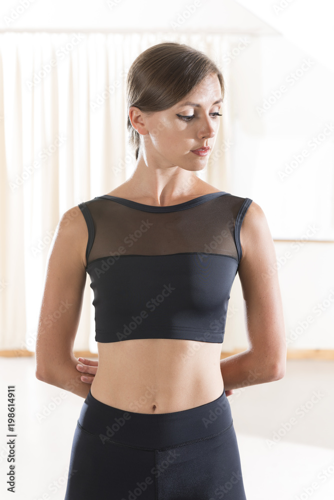 Portrait of Young Woman Wearing Sports Crop Top and Matching Pants